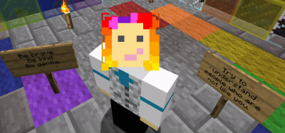 A screenshot from within the game, Minecraft. There is a player avatar with pale skin, rainbow hair, and a silver vest. There are two signs visible. The one on the left says, "Be brave. Be kind. Be gentle." and the one on the right says "Try to understand people who are not like you."